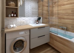 Malá koupelna s vanou obloženou dřevodekorem, deskou nad pračkou, umyvadlem ve skříňce a obkladem s geometrickým vzorem