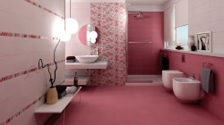 Růžová koupelna s bílými  a květinovými obklady, kulatým zrcadlem, sprchovým koutem a WC s bidetem