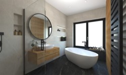 Moderní koupelna s volně stojící vanou, kulatým zrcadlem v černém rámu, světlé obklady a tmavá dlažba